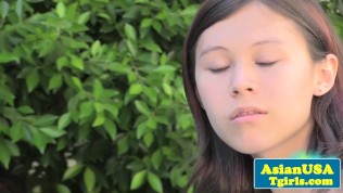 Cute asian TS Ren Rika tugging outdoors
