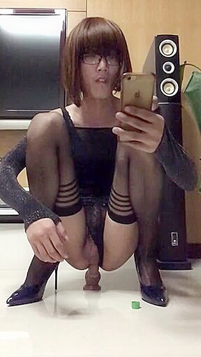 Asian Crossdresser Fucks Herself With A Dildo